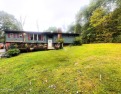 Located on a sprawling one-acre lot, this bi-level home offers for sale in Roaring Spring Pennsylvania Bedford County County on GolfHomes.com