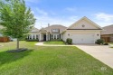 Discover the perfect combination of modern living and coastal for sale in Foley Alabama Baldwin County County on GolfHomes.com
