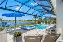 Timeless 2022-built pool home that overlooks the tranquil lake for sale in Vero Beach Florida Indian River County County on GolfHomes.com