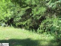Wooded building lot at the sought-after Rock at Joccassee golf for sale in Pickens South Carolina Pickens County County on GolfHomes.com