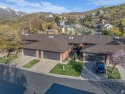 This clean, well-maintained 4-bedroom, 2.5-bath condo offers for sale in Bountiful Utah Davis County County on GolfHomes.com