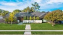 This extraordinary single story new construction sits on a prime for sale in Farmers Branch Texas Dallas County County on GolfHomes.com