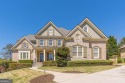 As You Approach this Stunning Home, Your Senses are Immediately for sale in Suwanee Georgia Gwinnett County County on GolfHomes.com