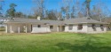 Mid century modern home ready to be renovated. Great investment for sale in Covington Louisiana St. Tammany Parish County on GolfHomes.com