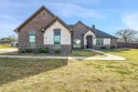 4 bedroom, 3 bath home with a swimming pool located in the for sale in Lindale Texas Smith County County on GolfHomes.com