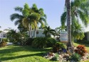 This tropical oasis features an updated interior, lush for sale in Naples Florida Collier County County on GolfHomes.com