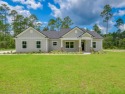 Exquisite new construction on hole 5 of the new, state of the for sale in Crawfordville Florida Wakulla County County on GolfHomes.com