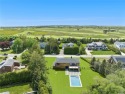 This stunning new construction is situated near the pristine for sale in Southampton New York Suffolk County County on GolfHomes.com