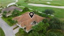 Courtyard pool home on a golf course in the coveted Grand Harbor for sale in Vero Beach Florida Indian River County County on GolfHomes.com