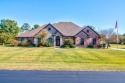 This custom brick & stone home sits on the #11 tee box and has for sale in Gainesville Texas Cooke County County on GolfHomes.com