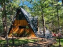 This one of a kind Scandanavian inspired A-frame offers a for sale in Pottsboro Texas Grayson County County on GolfHomes.com
