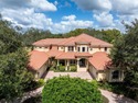 Welcome to this exquisite custom-built estate home perfectly for sale in Tarpon Springs Florida Pinellas County County on GolfHomes.com