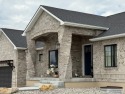 Spiral piers are the focal point of the double door grand entry for sale in Rexburg Idaho Madison County County on GolfHomes.com