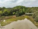 Nearly an acre of tranquility awaits! Fantastic marsh views with for sale in Beaufort South Carolina Beaufort County County on GolfHomes.com