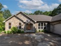 Beautifully landscaped and surrounded by mature trees! This for sale in Bella Vista Arkansas Benton County County on GolfHomes.com