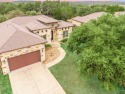 This spacious single-story home features a 2-car garage and a for sale in Lago Vista Texas Travis County County on GolfHomes.com