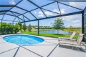 This newly built, elegant pool home backs to a serene lake for sale in Vero Beach Florida Indian River County County on GolfHomes.com