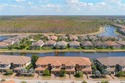 Step into sophisticated coastal living in this Bellisimo VII for sale in Naples Florida Collier County County on GolfHomes.com