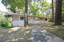 Fully-remodeled home just a few hundred feet from Sugar Creek for sale in Bella Vista Arkansas Benton County County on GolfHomes.com