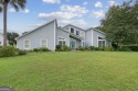 Striking modern home on the 6th green in the gated community of for sale in Saint Marys Georgia Camden County County on GolfHomes.com