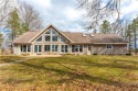 Experience the epitome of lakeside luxury with this captivating for sale in Chippewa Falls Wisconsin Chippewa County County on GolfHomes.com