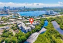 This exceptional corner unit comes with 2 cover parking spaces for sale in North Miami Beach Florida Miami-Dade County County on GolfHomes.com