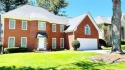 Welcome home to this charming & spacious four-sided brick home for sale in Stone Mountain Georgia De Kalb County County on GolfHomes.com