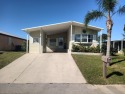 This spacious offset double-wide home can fulfill your dreams of for sale in Fort Pierce Florida Saint Lucie County County on GolfHomes.com