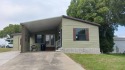 A charming 2-bedroom 2-bath open floor plan home, situated in a for sale in Leesburg Florida Lake County County on GolfHomes.com