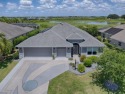 BOND PAID on this STUNNING 3/2 IRIS with SALT WATER HEATED POOL for sale in The Villages Florida Sumter County County on GolfHomes.com