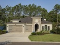 This luxury four bedroom, three bath upgraded home on a wooded for sale in Fernandina Beach Florida Nassau County County on GolfHomes.com