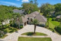Nestled beneath a canopy of mature oak trees in the gated for sale in Jacksonville Florida Duval County County on GolfHomes.com