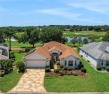 BOND PAID on this GORGEOUS BLOCK/STUCCO LANTANA DESIGNER model for sale in The Villages Florida Sumter County County on GolfHomes.com