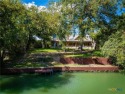 Welcome home to 302 Guadalupe River Drive, a custom waterfront for sale in Seguin Texas Guadalupe County County on GolfHomes.com