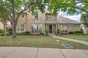 The meticulously maintained home sits inside a gorgeous gated for sale in Irving Texas Dallas County County on GolfHomes.com