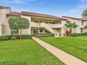 Serene 2nd Floor, Lakefront 2/2 w/vaulted ceilings & a split for sale in Boynton Beach Florida Palm Beach County County on GolfHomes.com