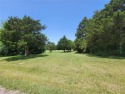Beautiful, heavily treed lot with golf course views on the 17th for sale in Pottsboro Texas Grayson County County on GolfHomes.com