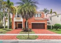 Stunning expanded Valencia model with a true 3 car garage! for sale in Parkland Florida Broward County County on GolfHomes.com