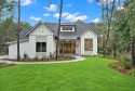 This stunning NEW CONSTRUCTION home Wild Heron is a single level for sale in Panama City Beach Florida Bay County County on GolfHomes.com