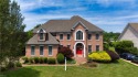 Welcome to your dream home, an all-brick w/ side load three car for sale in Suffolk Virginia Suffolk County County on GolfHomes.com