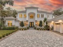 Experience the epitome of luxury living with this custom-built for sale in Palm Coast Florida Flagler County County on GolfHomes.com