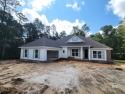 Nestled in the sought-after golf course community of Timbercreek for sale in Daphne Alabama Baldwin County County on GolfHomes.com