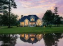Indulge in the exquisite charm of this luxurious French Country for sale in Wallace North Carolina Duplin County County on GolfHomes.com
