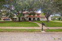 Welcome to this beautifully maintained Spanish-style two-story for sale in Victoria Texas Victoria County County on GolfHomes.com
