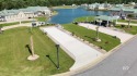 Escape to effortless lakeside luxury on Lot 122 at Lake Osprey for sale in Elberta Alabama Baldwin County County on GolfHomes.com