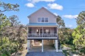 Spacious elevated beach house in Surfside Shores, just 3 blocks for sale in Gulf Shores Alabama Baldwin County County on GolfHomes.com