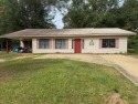 This home features a spacious layout with covered front and back for sale in Lumberton Mississippi Pearl River County County on GolfHomes.com