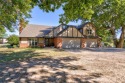 This charming two story Tudor style home boasts 5 bedrooms, 4 for sale in Shawnee Oklahoma Pottawatomie County County on GolfHomes.com