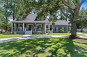Located in Wedgewood Estates, this Gulf Shores retreat with a for sale in Gulf Shores Alabama Baldwin County County on GolfHomes.com