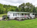 Welcome to 425 Lick Hollow Road, a property that blends country for sale in Greeneville Tennessee Greene County County on GolfHomes.com